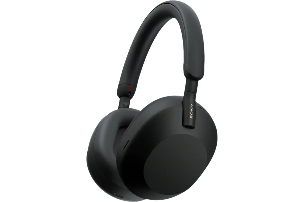 best noise cancelling headphones for travel on airplane tray table with coffee
