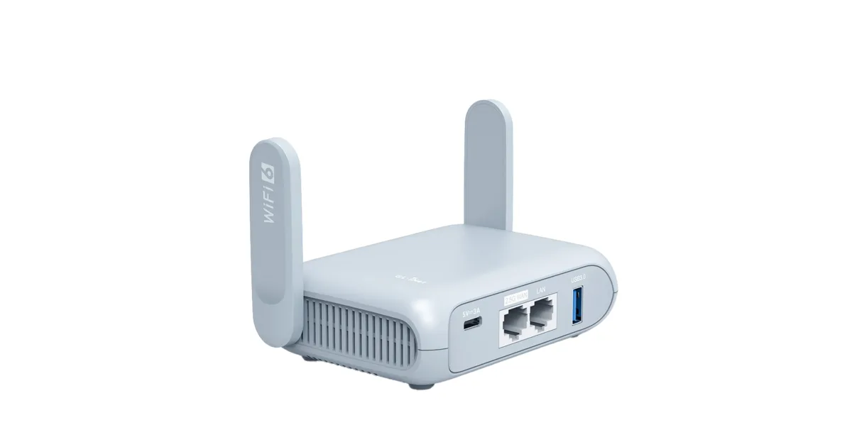 best travel router 2026 on wooden desk with laptop and coffee